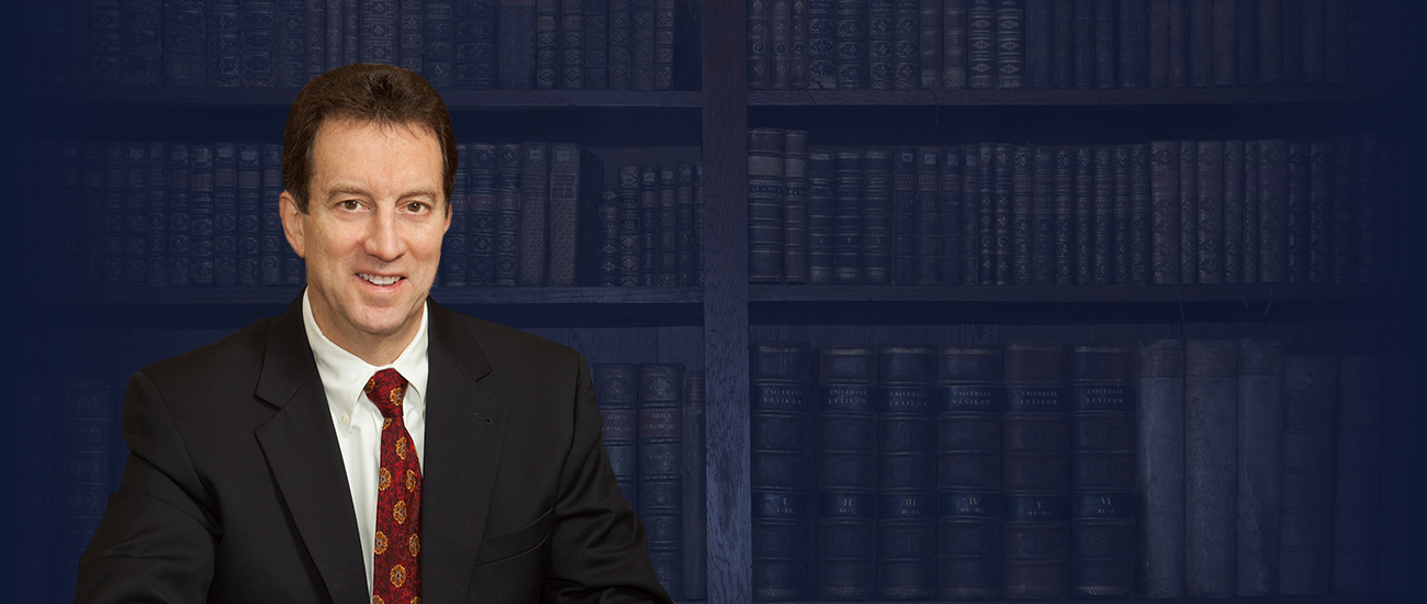 Attorney Michael P. Foley with books in the background