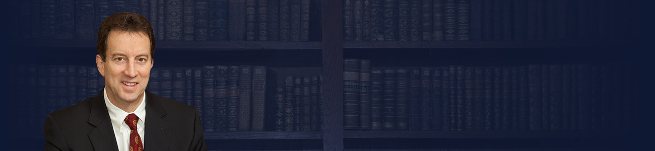 Attorney Michael P. Foley with books in the background